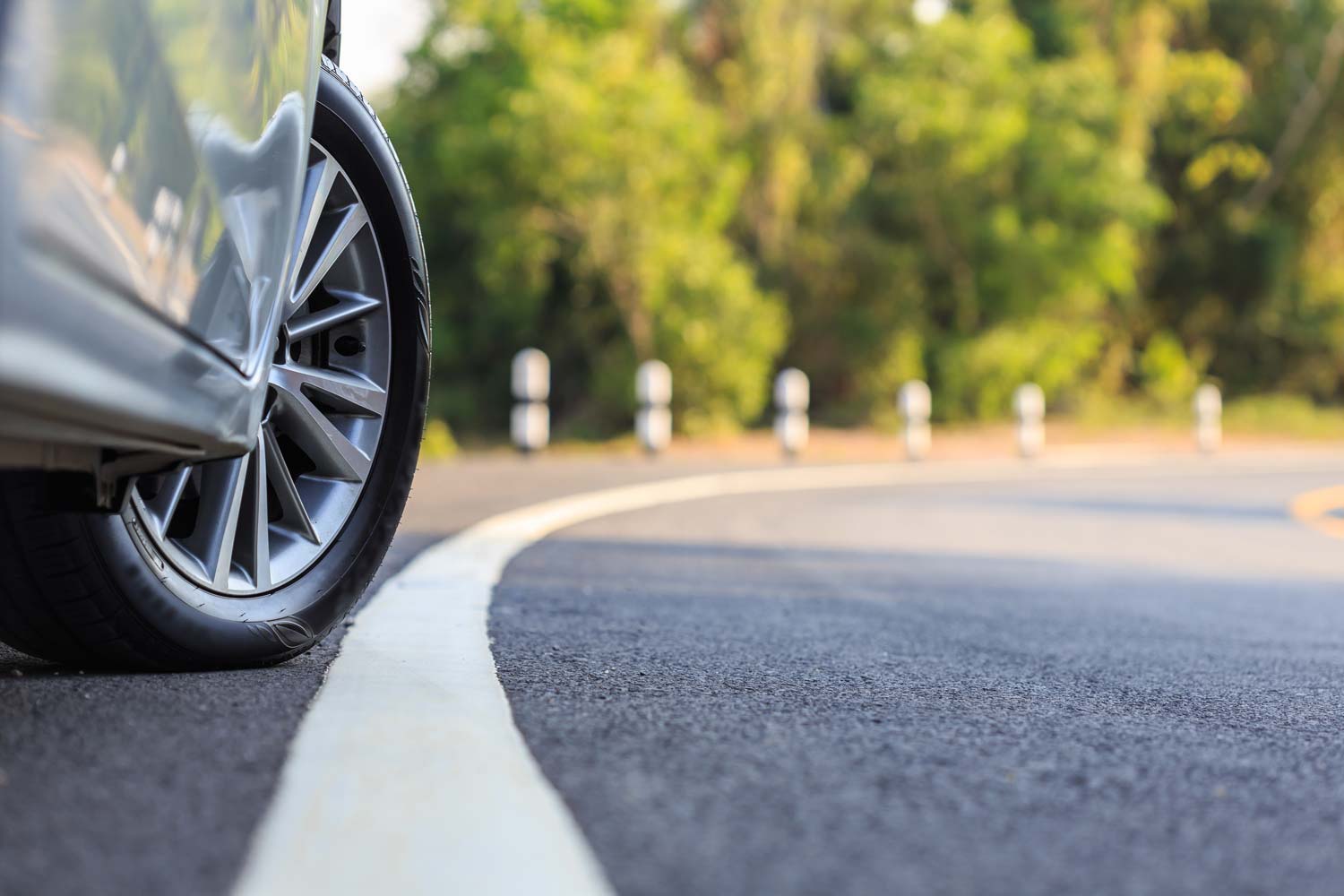 Car parked on side of curved road