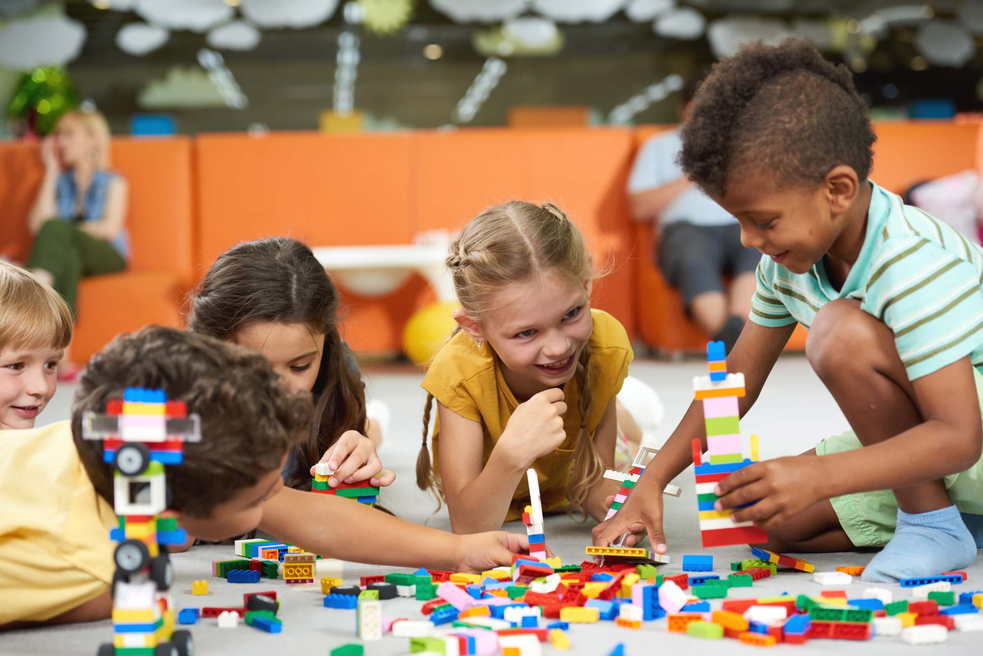 Group of children playing with connect bricks